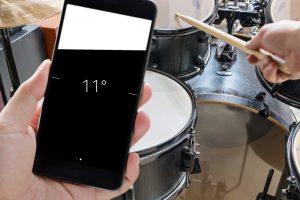 Drummer using a phone's compass app in spirit level mode